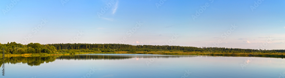 Panorama view of forest lake on sunset
