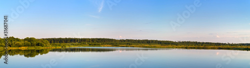 Panorama view of forest lake on sunset