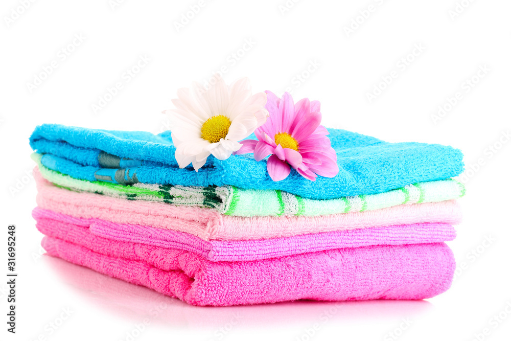 stacked colorful towels on a white background stacked colorful towels on a white background