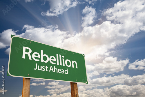 Rebellion Green Road Sign and Clouds photo