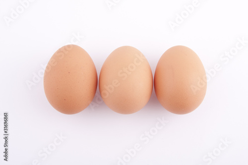 three eggs on the white