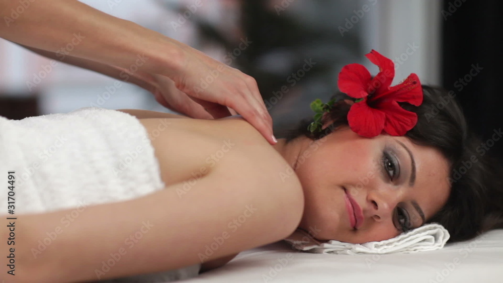 Beautiful young woman receiving back massage in Spa Beautiful young woman receiving back massage in Spa