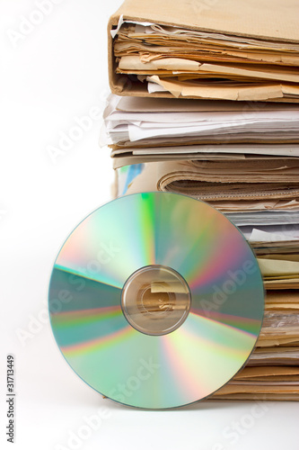 Stack of old paper files and  cd