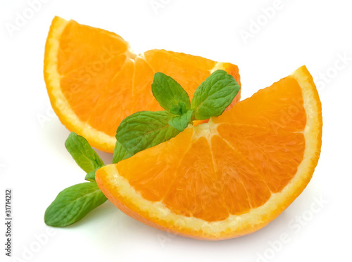 Segments of an orange with mint