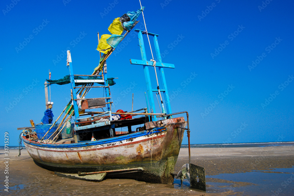 fisherman boat on the sea shore