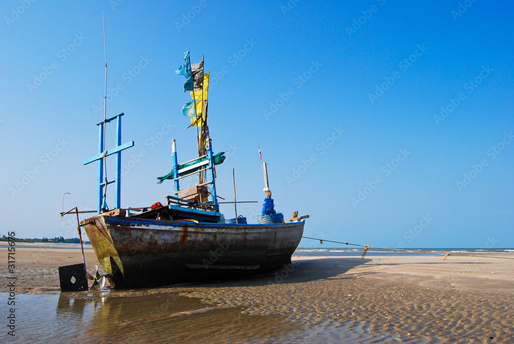 Fototapeta premium fisherman boat on the sea shore