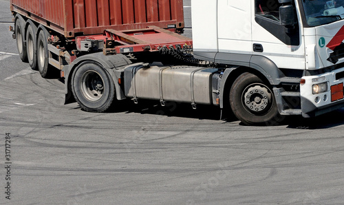 withe truck on the street photo