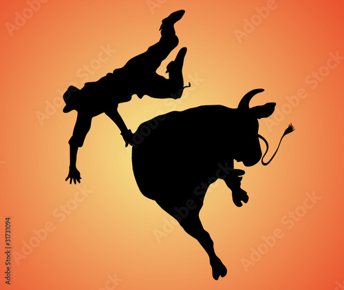 bull riding black silhouette on a sunrise background
