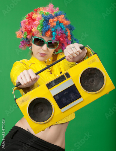 The girl in a color wig with the old tape recorder