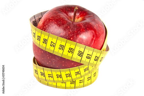 measuring tape around red apple isolated on white