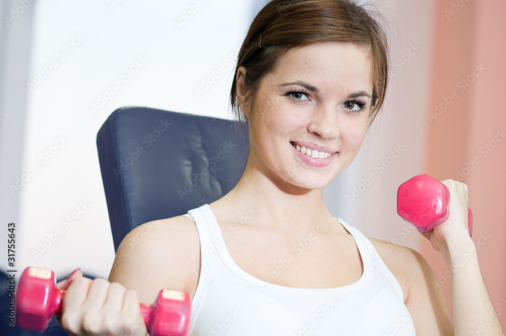 Beautiful sport woman doing exercise with dumbbell weight Beautiful sport woman doing exercise with dumbbell weight