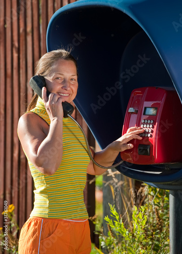 woman  on the payphone photo