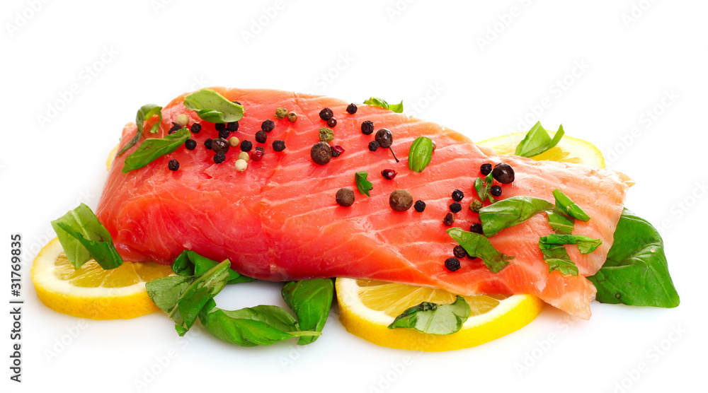 Red fish with pepper and green leaves isolated on white Red fish with pepper and green leaves isolated on white