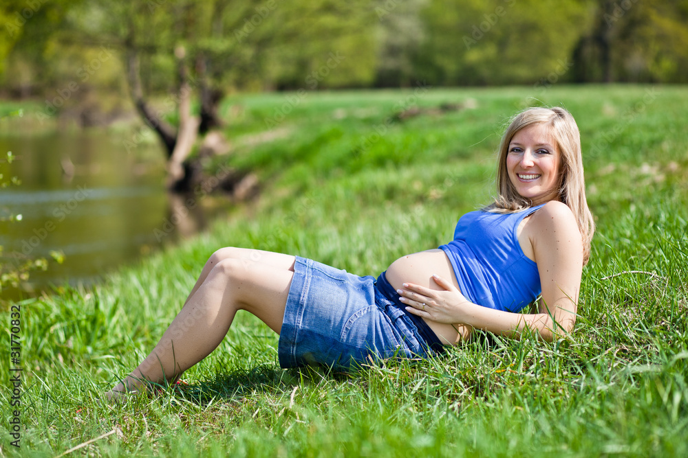 Fototapeta premium Pregnant woman outdoor spring time