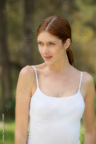 Beautiful woman standing in forest