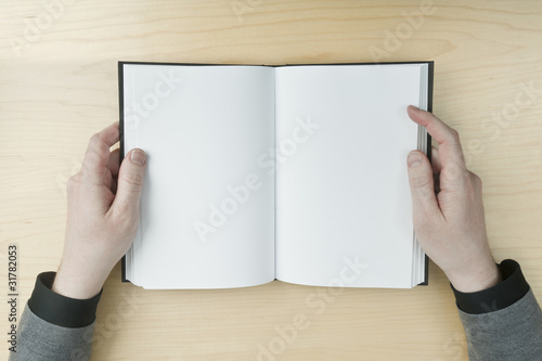 Man reading a blank book