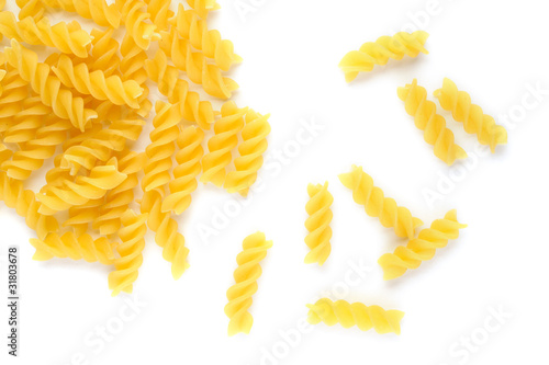 Pasta fusilli on white background photo