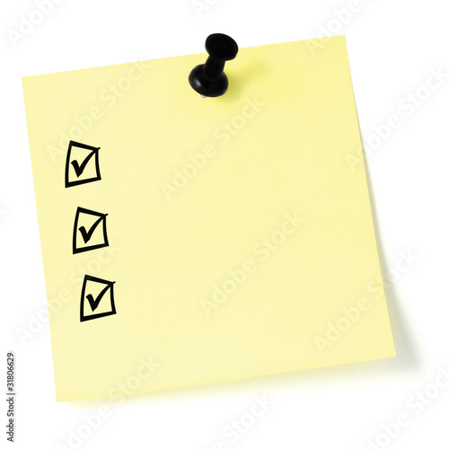 Fotografie Yellow sticker checklist black check boxes tick marks thumbtack