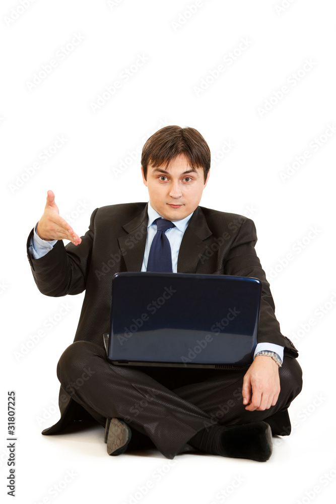 Sitting on floor businessman pointing on laptops monitor Sitting on floor businessman pointing on laptops monitor