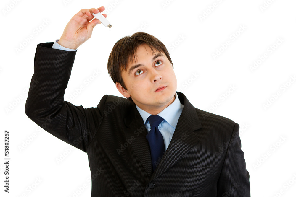 Businessman plugging flash drive into head. Future technologies. Businessman plugging flash drive into head. Future technologies.