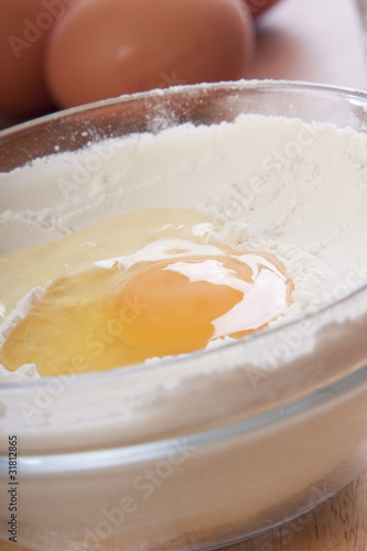 bowl with flour and an egg