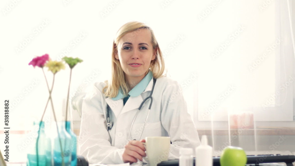 Female doctor in the office talking to camera, giving advice Female doctor in the office talking to camera, giving advice