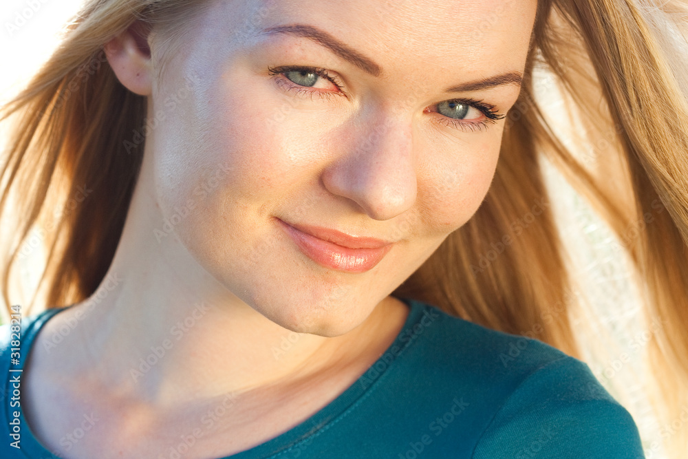 Fototapeta premium portrait of a beautiful young woman outdoor