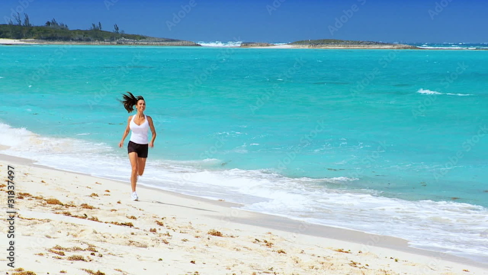 Healthy Female Jogging on Tropical Beach Healthy Female Jogging on Tropical Beach