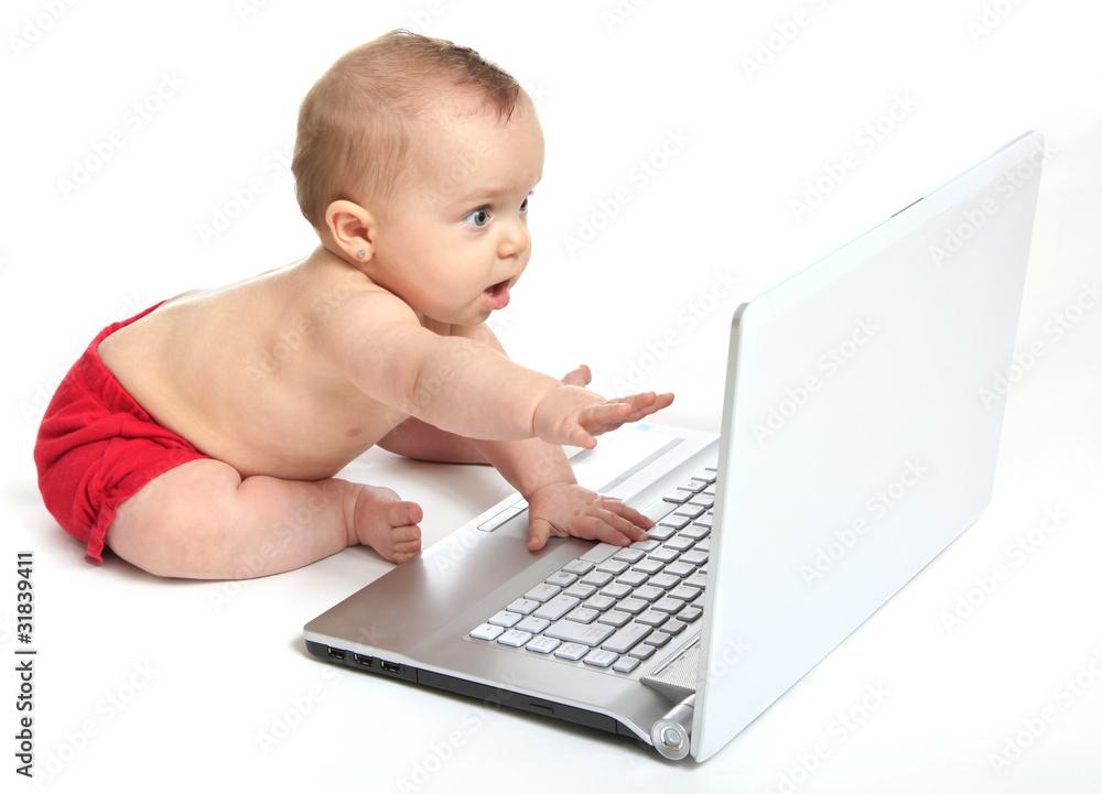 Baby girl playing the computer Baby girl playing the computer