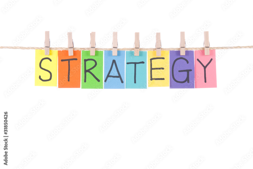 Strategy, words hang by wooden peg Strategy, words hang by wooden peg