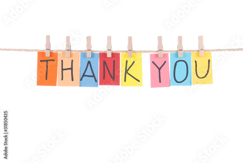 Thank you, words hang by wooden peg