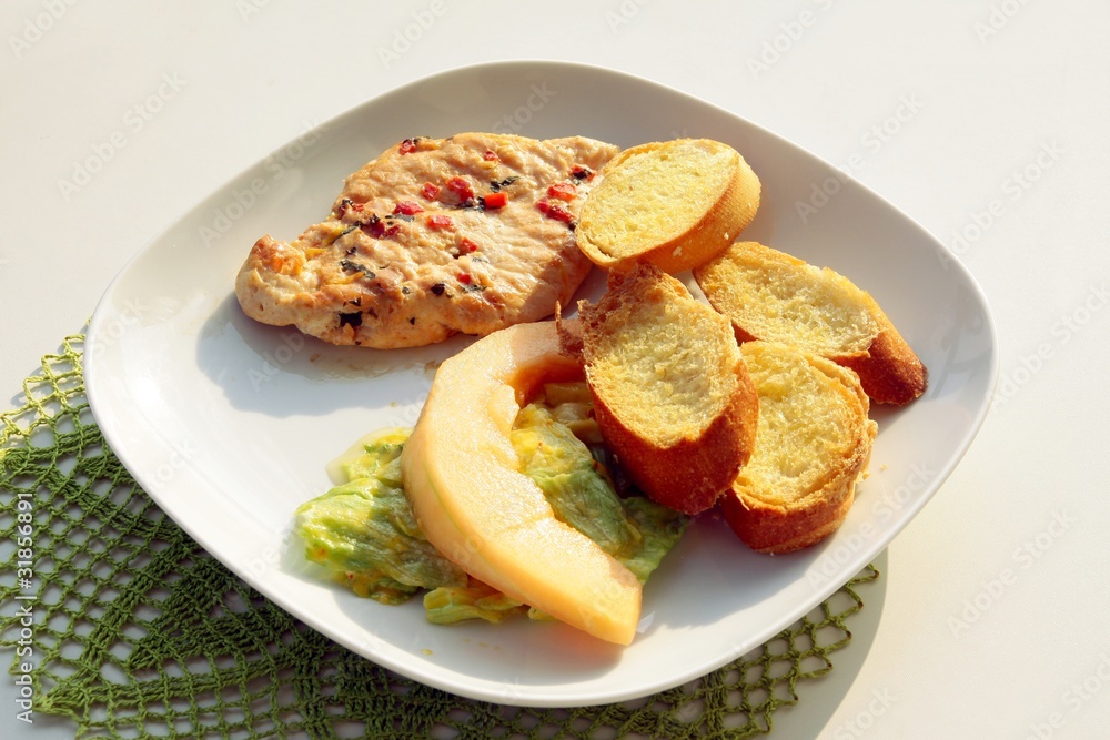 turkey brest meat baked with toasts and salad
