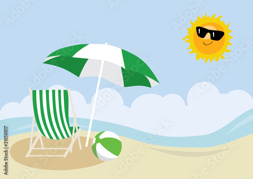 Deck chair, beach ball and umbrella on a beach