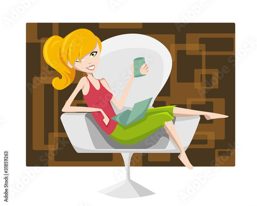 Young woman relaxing with laptop and coffee cup