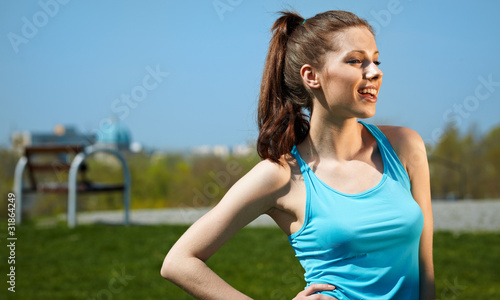 Smiling fitness woman.Park background