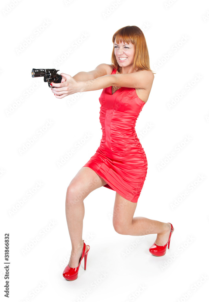 Beautiful woman in a red dress with a gun Beautiful woman in a red dress with a gun