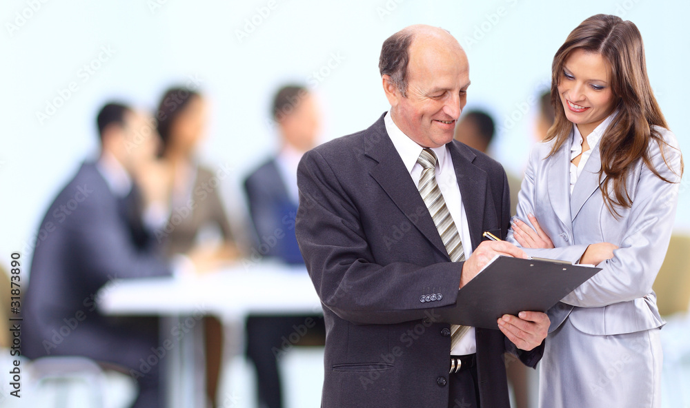 Image of three business people working at meeting Image of three business people working at meeting