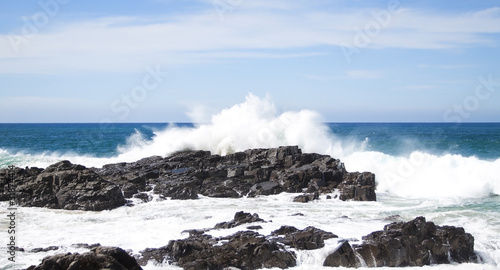 Waves crashing over rocks at the coast