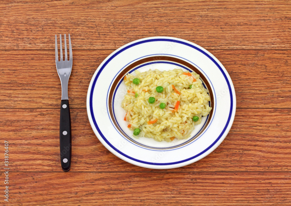 Serving of rice pilaf on small plate Serving of rice pilaf on small plate
