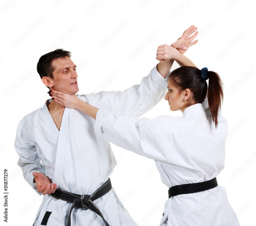 Karate. Young girl and a men in a kimono Karate. Young girl and a men in a kimono