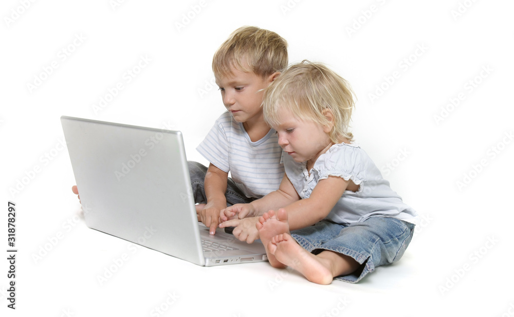 two kids with laptop over white