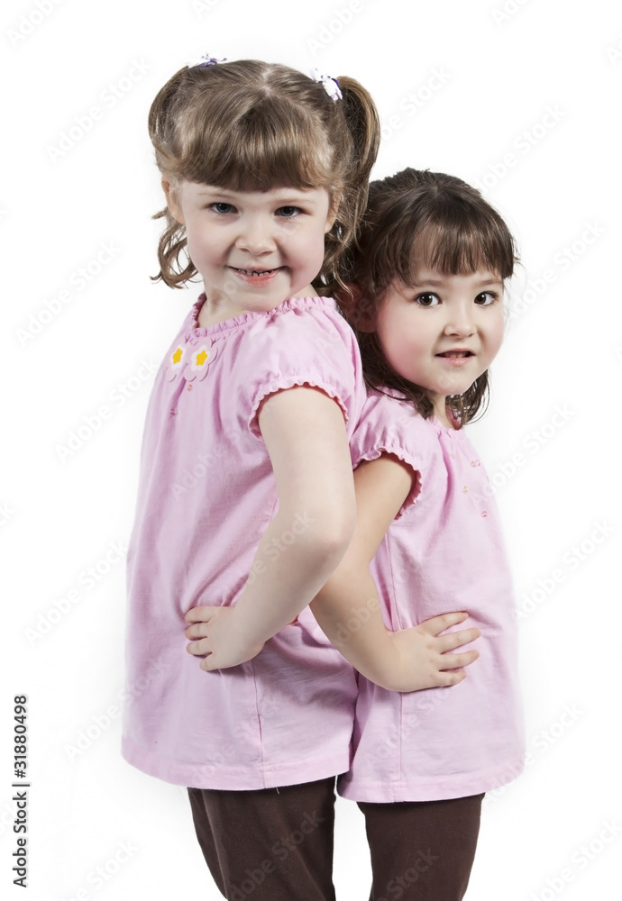 Adorable little twin girls isolated on white background