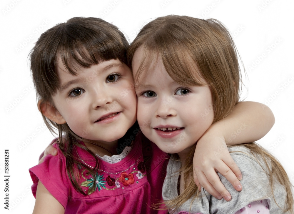 Two Adorable little girls isolated on white background Two Adorable little girls isolated on white background