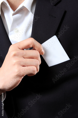Businessman Holding a Card out of his suit pocket