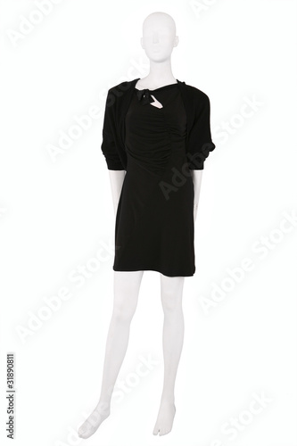 Little black dress and a cardigan dressed on a mannequin