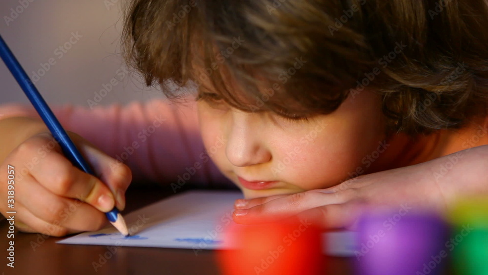 Girl drawing with crayons Girl drawing with crayons