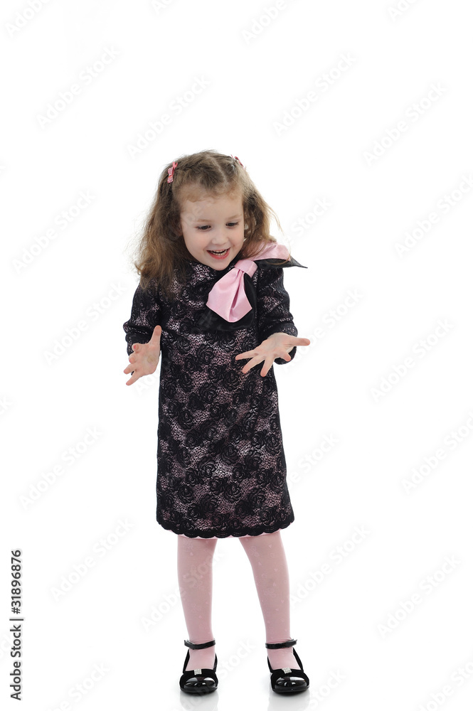 Pretty little surprised girl in black elegant party dress. isola Pretty little surprised girl in black elegant party dress. isola
