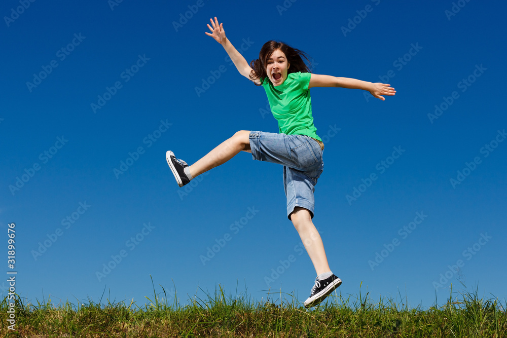 Girl jumping, running against blue sky Girl jumping, running against blue sky