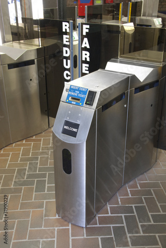 Modern subway ticket turnstile in stainless steel