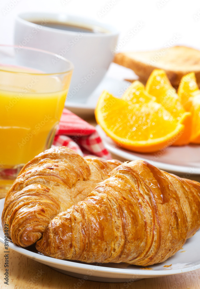 breakfast with croissants, juice and coffee breakfast with croissants, juice and coffee